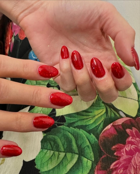 The color red is synonymous with Christmas and warm holiday cheer. Here, scroll through 18 red Christmas nail ideas for a festive touch this season.