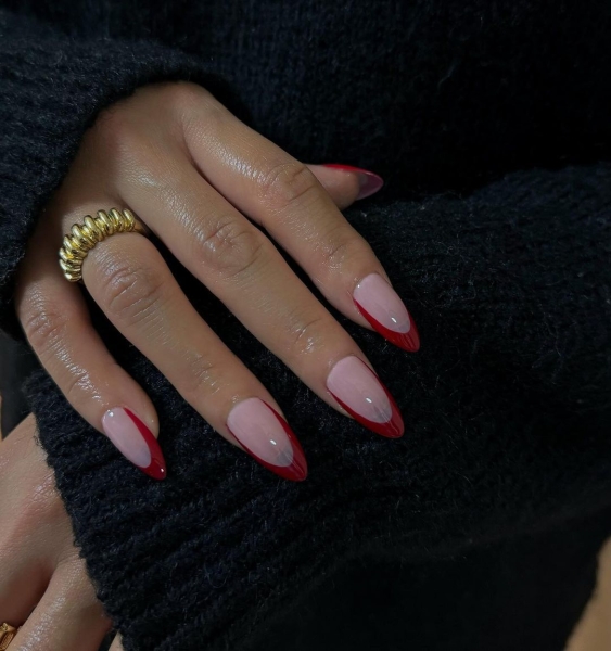 The color red is synonymous with Christmas and warm holiday cheer. Here, scroll through 18 red Christmas nail ideas for a festive touch this season.