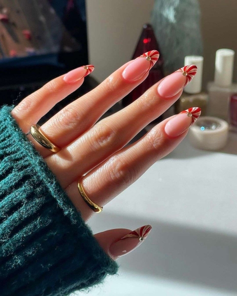 The color red is synonymous with Christmas and warm holiday cheer. Here, scroll through 18 red Christmas nail ideas for a festive touch this season.