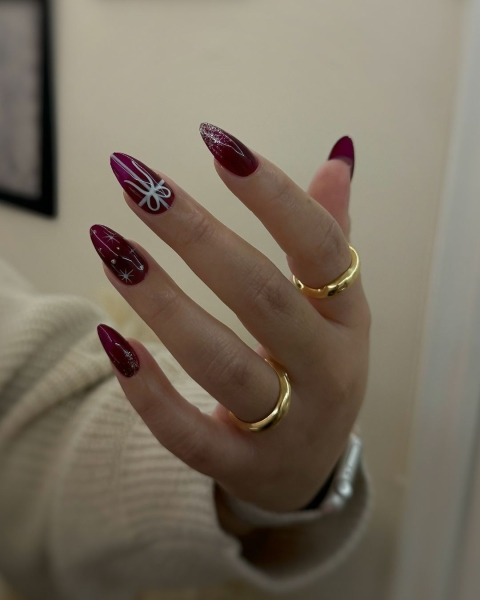 The color red is synonymous with Christmas and warm holiday cheer. Here, scroll through 18 red Christmas nail ideas for a festive touch this season.