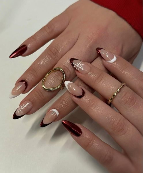 The color red is synonymous with Christmas and warm holiday cheer. Here, scroll through 18 red Christmas nail ideas for a festive touch this season.