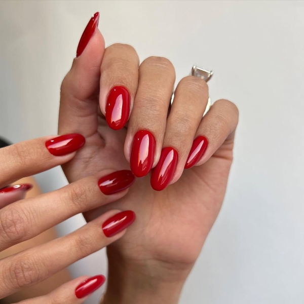 The color red is synonymous with Christmas and warm holiday cheer. Here, scroll through 18 red Christmas nail ideas for a festive touch this season.