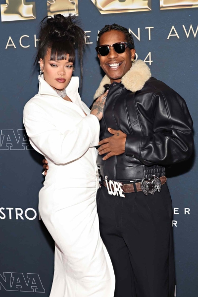 The Fenty founder joined her partner, A$AP Rocky, at the Footwear News Achievement Awards in New York City on Wednesday, December 4. See photos of her custom outfit, here.