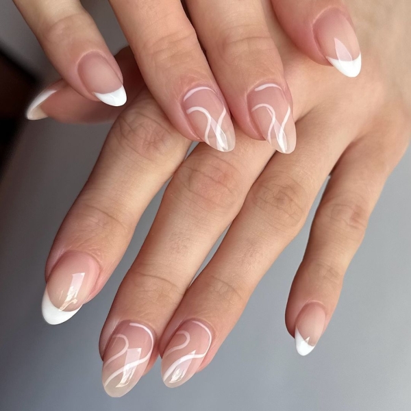 Whether you go for a classic French manicure, a milky-white base, or pop on a glittery top coat, you'll be left with a look that's festive for the season in an understated way. Browse through 20 stunning winter white nail ideas and screenshot your faves for your next manicure.