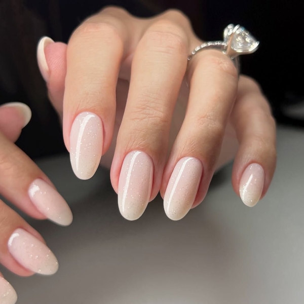 Whether you go for a classic French manicure, a milky-white base, or pop on a glittery top coat, you'll be left with a look that's festive for the season in an understated way. Browse through 20 stunning winter white nail ideas and screenshot your faves for your next manicure.