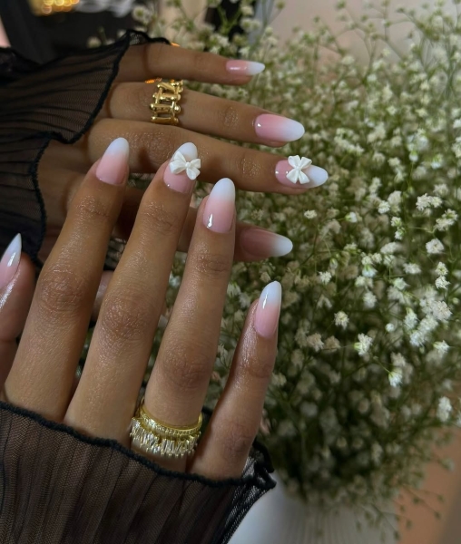 Whether you go for a classic French manicure, a milky-white base, or pop on a glittery top coat, you'll be left with a look that's festive for the season in an understated way. Browse through 20 stunning winter white nail ideas and screenshot your faves for your next manicure.