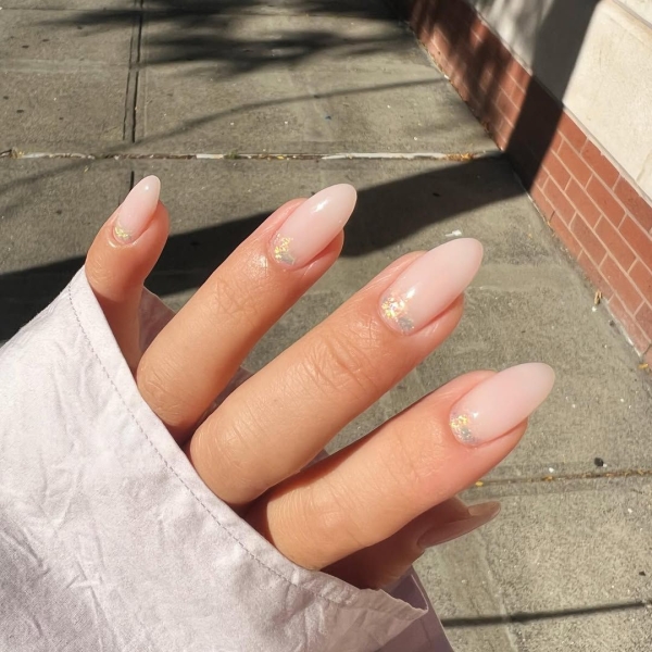 Whether you go for a classic French manicure, a milky-white base, or pop on a glittery top coat, you'll be left with a look that's festive for the season in an understated way. Browse through 20 stunning winter white nail ideas and screenshot your faves for your next manicure.