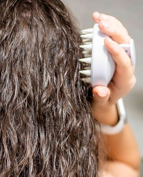 While not as visible as your face or hands, your scalp’s skin is just as important. And even though the skin is often hidden under hair, taking care of it has visual results. Scalp exfoliation is a key part of keeping our hair healthy, and for helping it to grow longer. Here's how to do it.