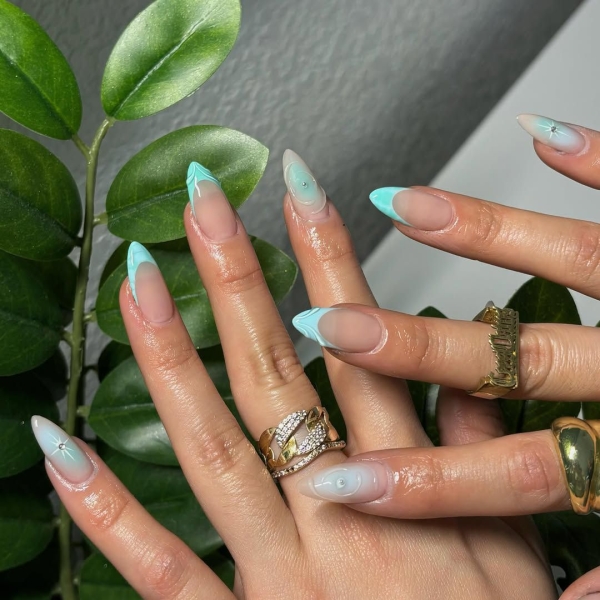 Aquarius season is upon us! For a celebratory manicure, consider shades of blues and purple, plus motifs that lean toward water and air. Scroll through 17 gorgeous Aquarius nail designs here.