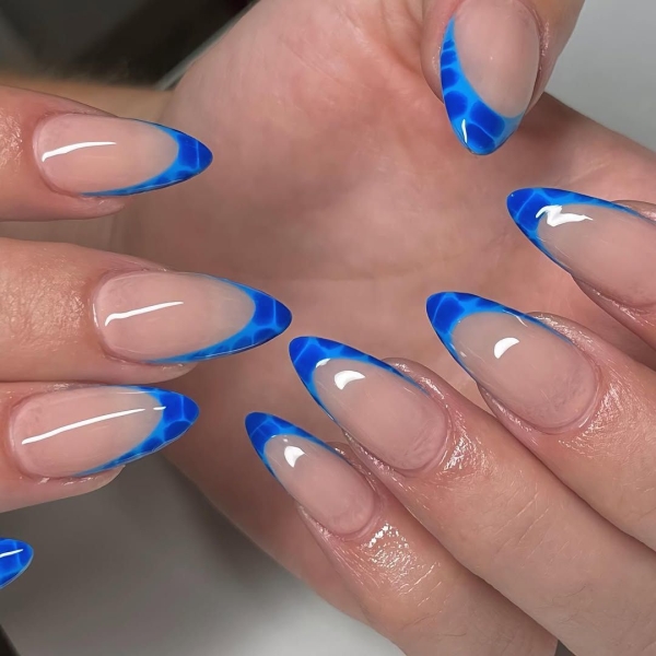 Aquarius season is upon us! For a celebratory manicure, consider shades of blues and purple, plus motifs that lean toward water and air. Scroll through 17 gorgeous Aquarius nail designs here.