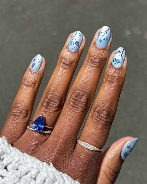 Aquarius season is upon us! For a celebratory manicure, consider shades of blues and purple, plus motifs that lean toward water and air. Scroll through 17 gorgeous Aquarius nail designs here.