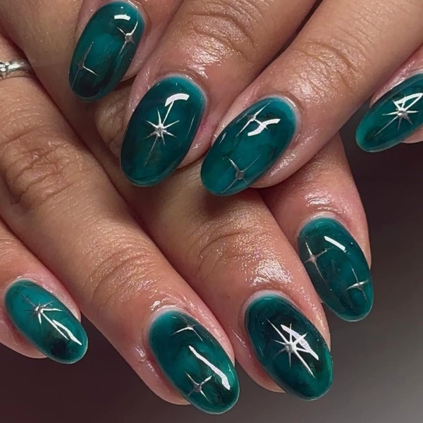 Aquarius season is upon us! For a celebratory manicure, consider shades of blues and purple, plus motifs that lean toward water and air. Scroll through 17 gorgeous Aquarius nail designs here.