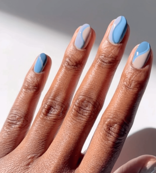 Aquarius season is upon us! For a celebratory manicure, consider shades of blues and purple, plus motifs that lean toward water and air. Scroll through 17 gorgeous Aquarius nail designs here.