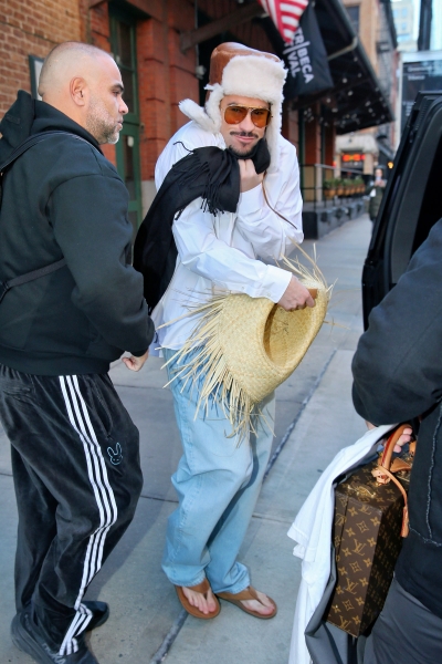 Bad Bunny Defies Winter Weather in Flip Flops and a Shearling Hat