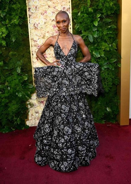 Cynthia Erivo attended the 2025 Golden Globes in a plunging black-and-silver peplum gown. See Erivo's 2025 Golden Globes outfit here.