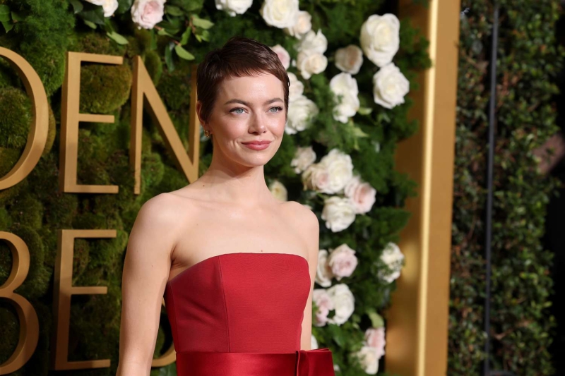 Emma Stone arrived at the 2025 Golden Globes with a super short new pixie haircut. See her hair transformation here.