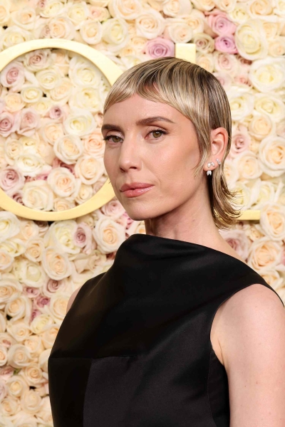 From Michelle Yeoh's super sharp front bang to Pamela Anderson's soft curtain bangs, see the bangs that stole the show at the 2025 Golden Globes.