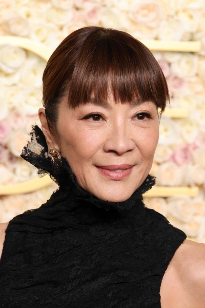 From Michelle Yeoh's super sharp front bang to Pamela Anderson's soft curtain bangs, see the bangs that stole the show at the 2025 Golden Globes.