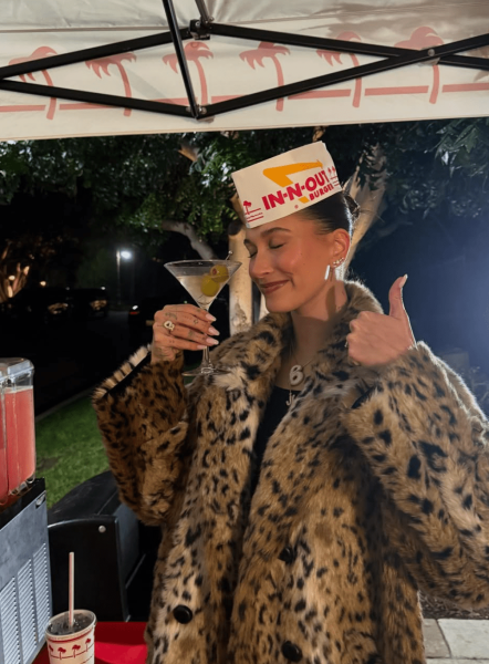 Hailey Bieber wore lingerie to her In-N-Out-themed New Year's Eve celebration. See her look, here.