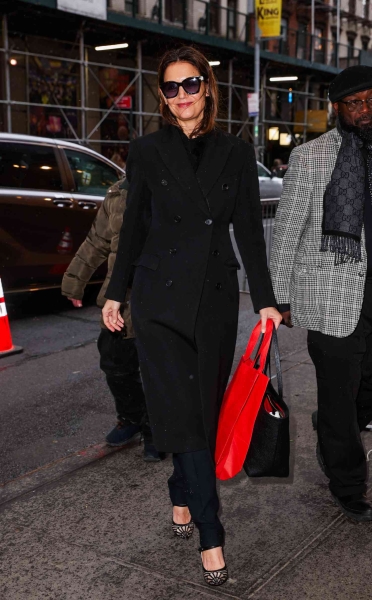 Katie Holmes' latest look used the classic styling trick of adding a few purposeful pops of red to an all-black look.