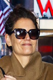 Katie Holmes was spotted out in New York City wearing a pair of white ballet flats with black ankle-length socks. See her quirky footwear combination, here.