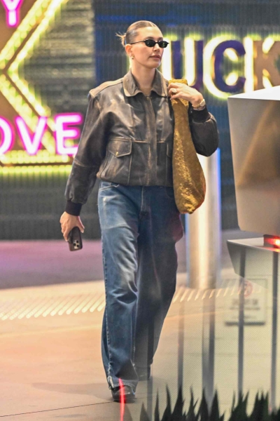 Look of the Day for January 7, 2025 features Hailey Bieber in a winter-perfect outfit that includes barrel-leg jeans, cool moto jacket, and black loafers. Shop similar pieces from Nordstrom, Mother, Pistola, and more.