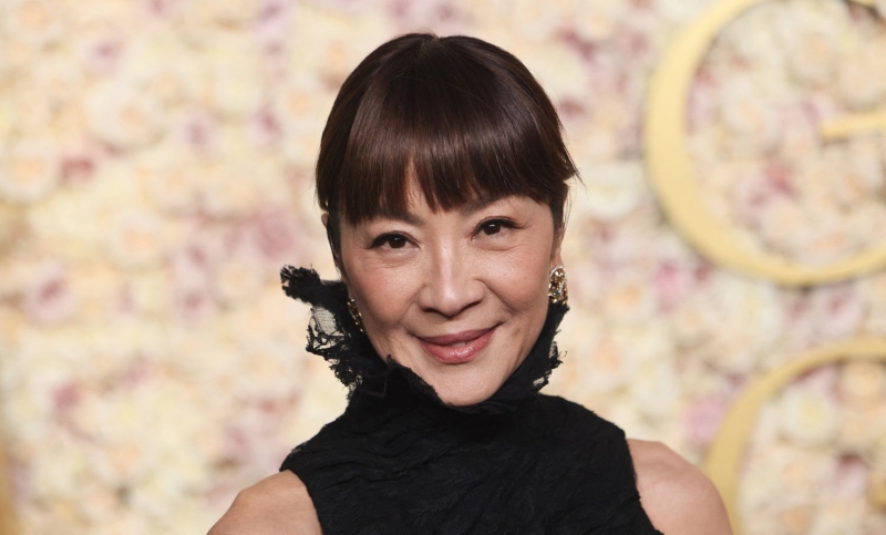 Michelle Yeoh presented at the 2025 Golden Globe Awards and wore a gown by Balenciaga and a fresh set of bangs. See Yeoh's 2025 Golden Globes red carpet and presenting outfits here.