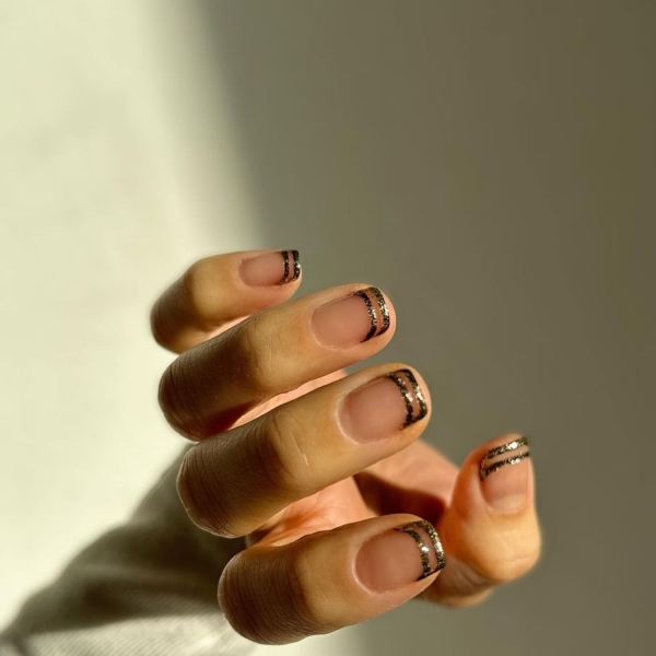 Professional manicurists suspect metallic accents, animal print, and shades of blue to be wildly popular in January. Here, explore their favorite January nail looks.