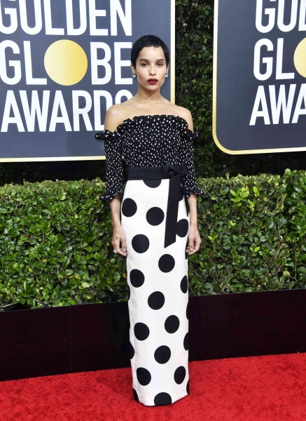 Zoë Kravitz attended the 2025 Golden Globes wearing a custom Saint Laurent gown by Anthony Vaccarello. It features a plunging sweetheart neckline and a cascading sash. See her full look, here.